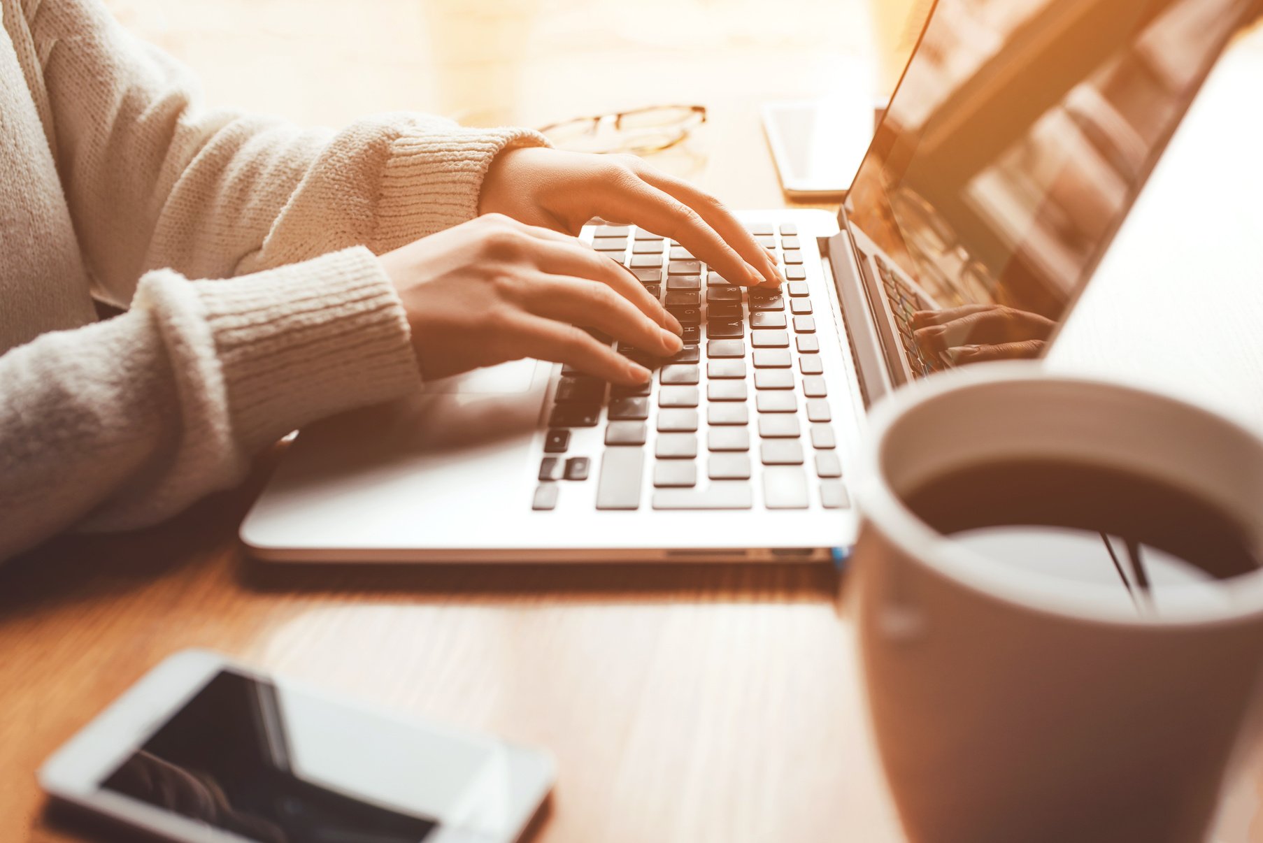 Young Woman Working in Home on Her Laptop Computer.